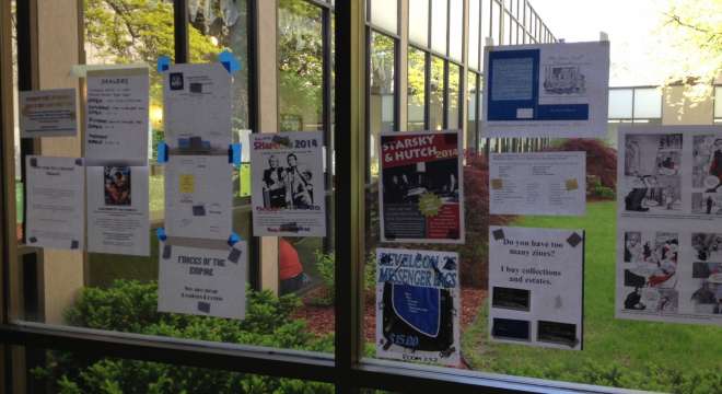 Flyers on a hotel corridor window at MediaWest*Con 34.